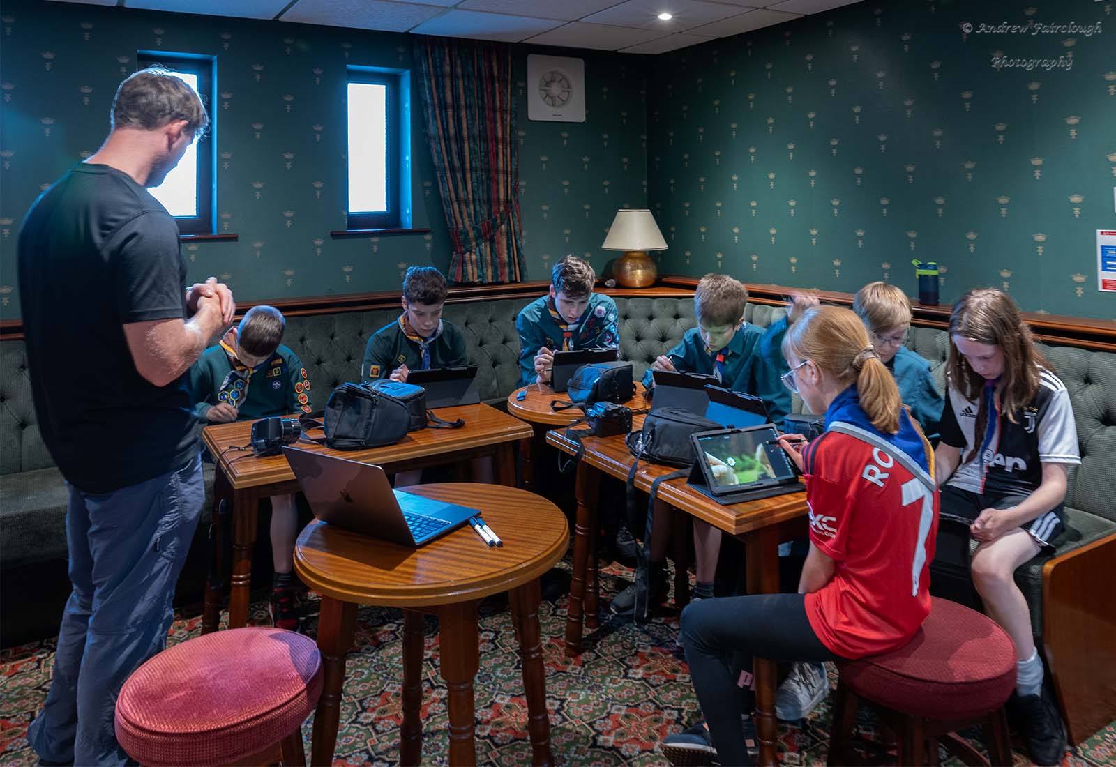 Young people trying photography for the first time during a school session.
