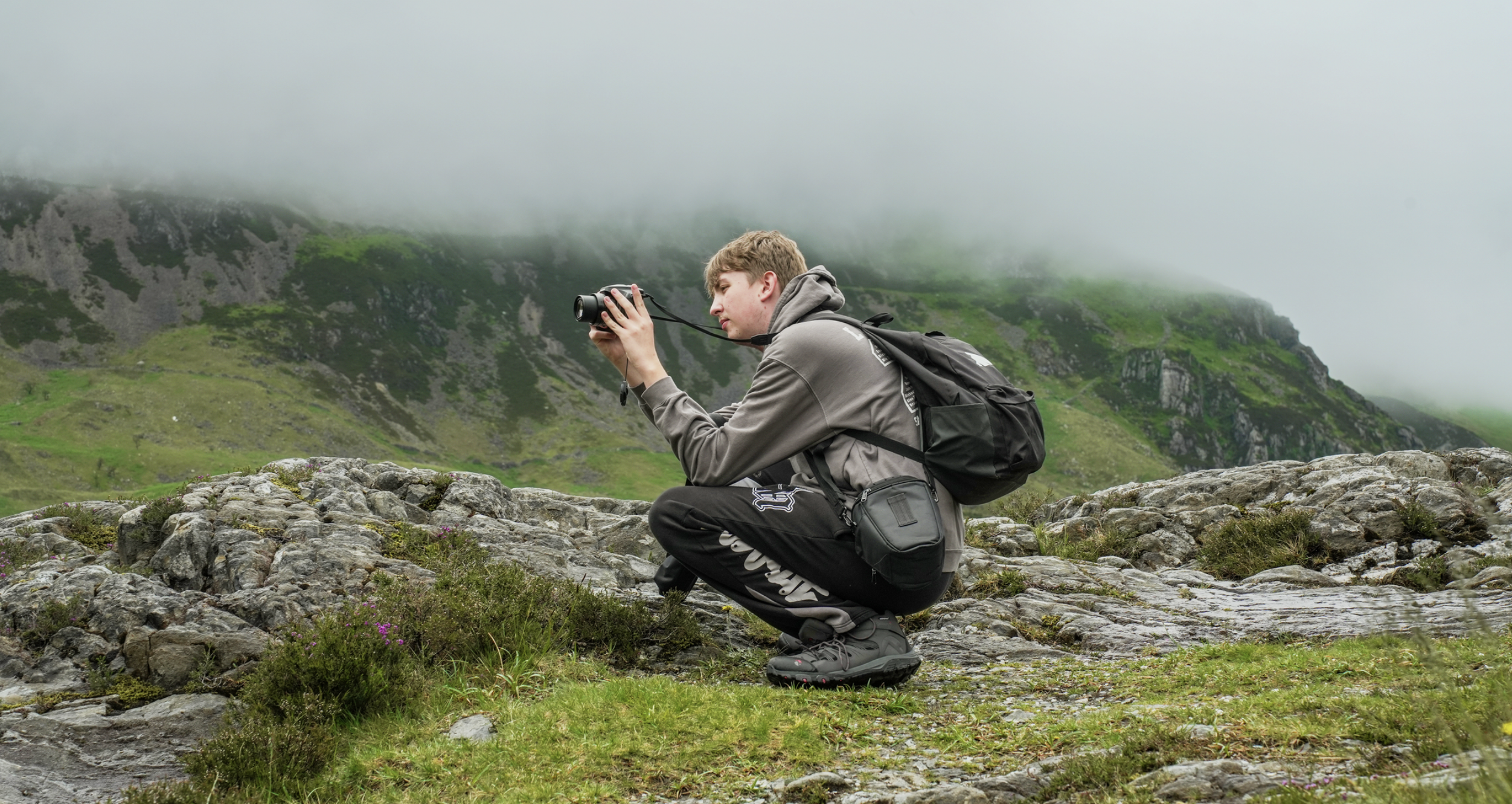 Young people photographing the landscape during a residential trip to North Wales.